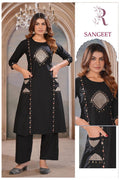 Front view of black A-line cotton kurta featuring a round neck, 3/4 sleeves, and intricate embroidery on the front yoke with functional side pockets.